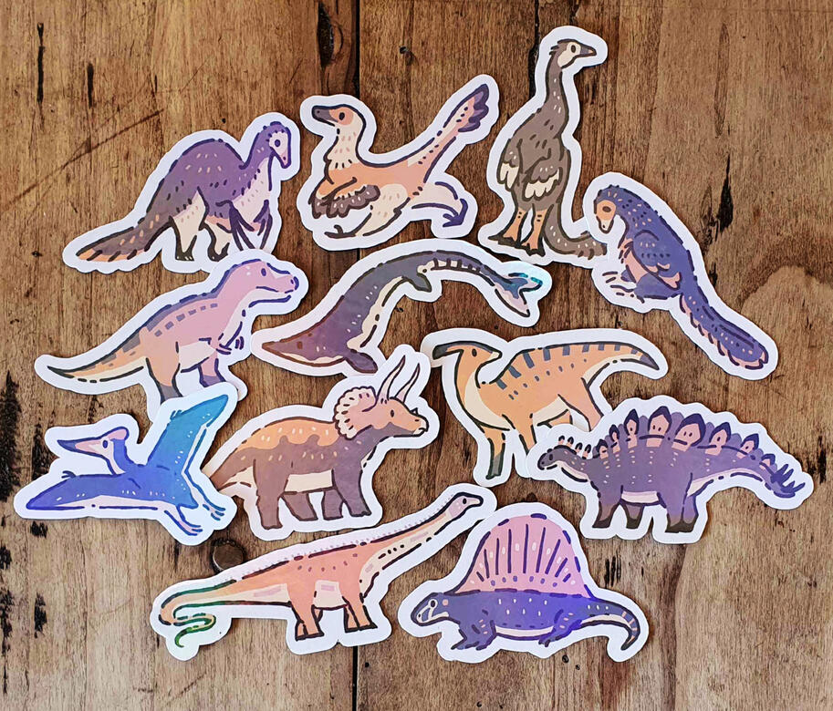 12 autocollants différents représentant des dinosaures et d&#39;autres animaux préhistoriques.