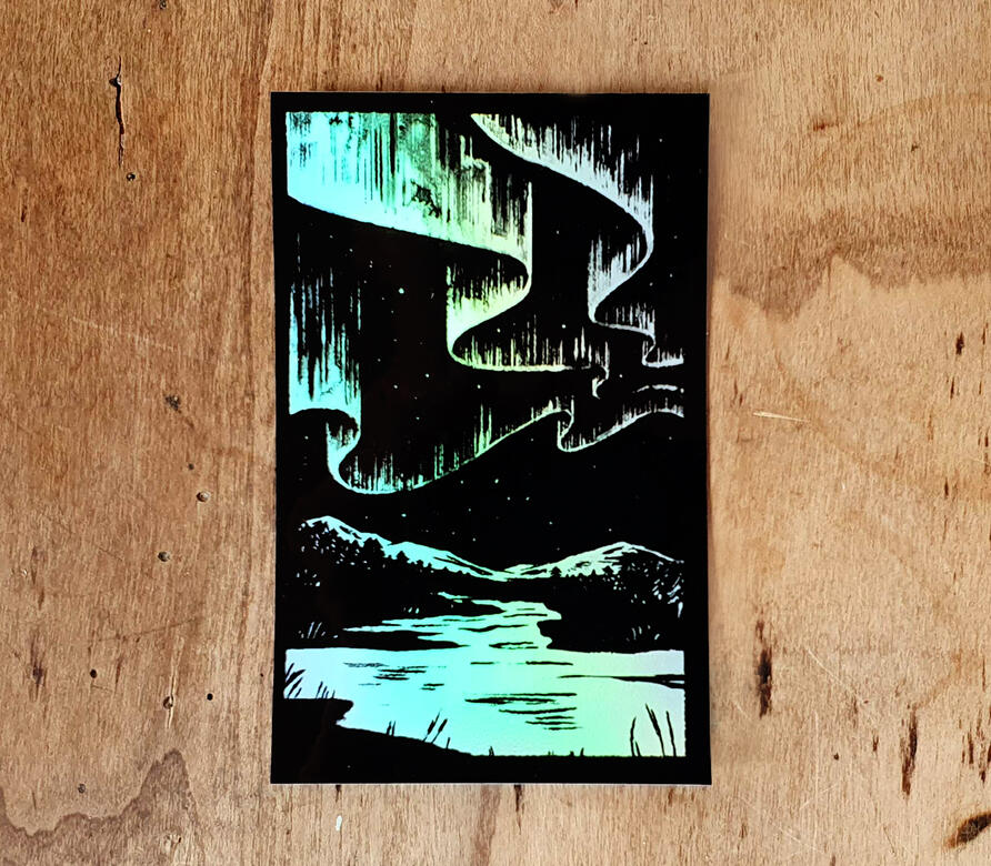 Aufkleber mit Abbildung einer Landschaft.